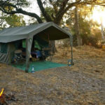 Okavango Expeditions guest tent exterior at sunset