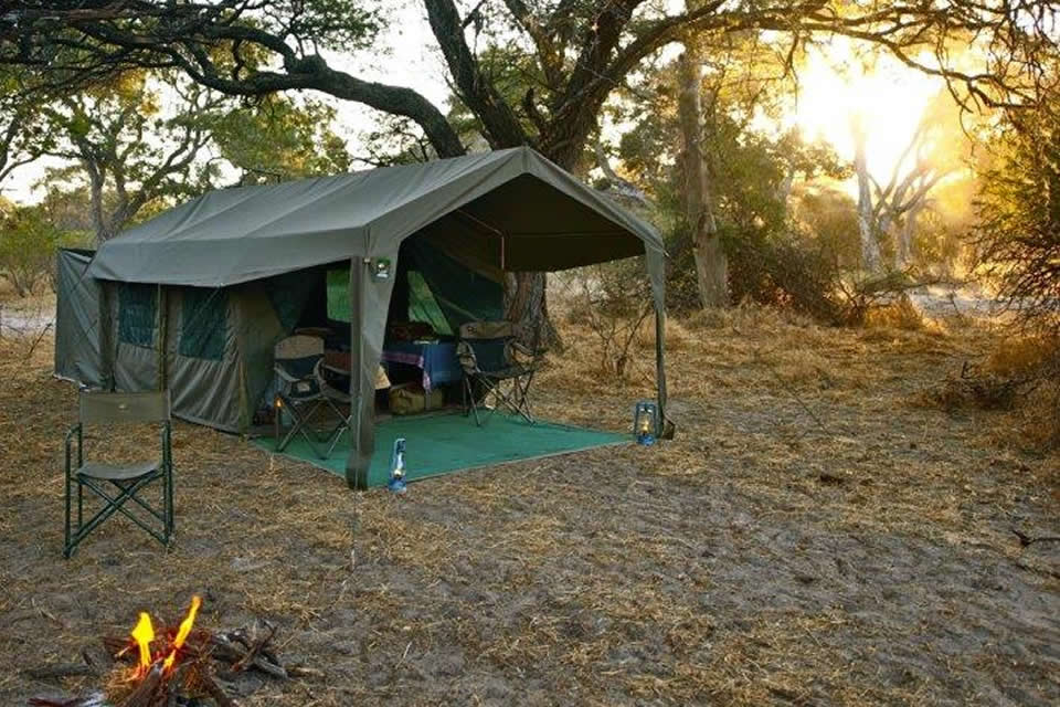 Okavango Expeditions guest tent exterior at sunset